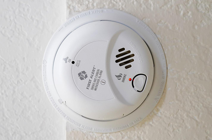 Seasonal home maintenance includes verifying smoke detectors